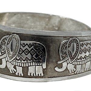 Chunky silver bracelet with marching elephants